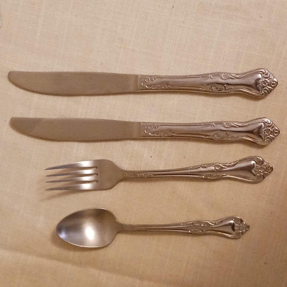 Four pieces of Oneida Fredericksburg Style silverware